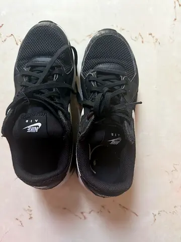 Black Nike Air sneakers - size not specified, lightly used