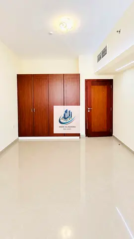 Premium class 1bhk in Fully Family building🏢 Near Sahara center Al nahda Sharjah 1Room with cupboard and close Hall premium kitchen with new woodish cabnots perfect for families