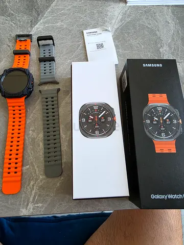 Samsung Galaxy Watch with extra orange and gray straps, like-new