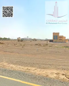 Two **adjacent residential plots** are available for sale in an excellent location in **Al Manama, S