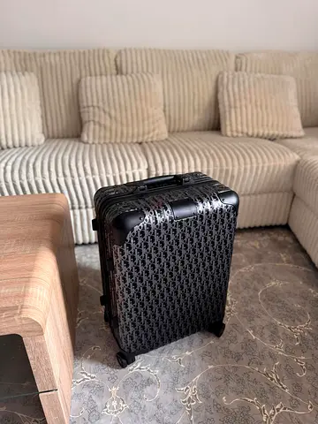 Rimowa and Dior cabin travel luggage bag
