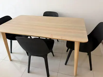 Light wood dining table with 4 black chairs - simple modern set