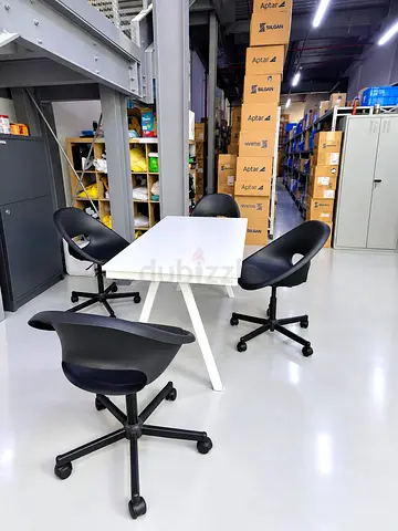 White modern office table with 4 black swivel chairs - set