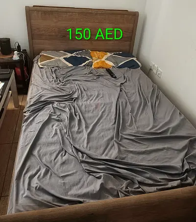 Wooden double bed frame with headboard - good condition, 150 AED