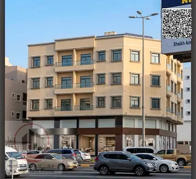 Building for sale in Ajman, on the main Al Humaidiya Street. Land area: 7,109.51 sq. ft. Ground floor + 3 upper floors.