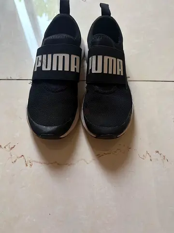Puma black slip-on sneakers, lightly used, size not marked