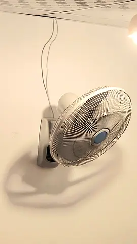 Wall-mounted oscillating fan with remote - good working condition