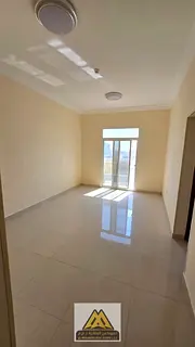 One-bedroom apartment with a living room in Al Jurf 3; features a balcony, built-in wardrobes, centr