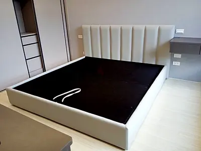 Modern upholstered king-size platform bed frame with tall padded headboard