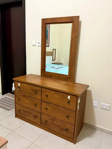 Dresser with mirror attached