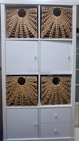 White storage cabinet with woven rattan baskets - good condition