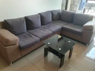 L-shaped 5-seater fabric sofa with coffee table in good condition