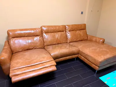 Genuine leather L-shaped reclining sofa - tan, good condition