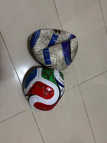 Two footballs (both ready to pump) - elite used balls