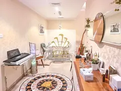 For sale in Conqueror Tower, Ajman: 2-bedroom apartment, 1,600 sq. ft., open city and creek view, cl
