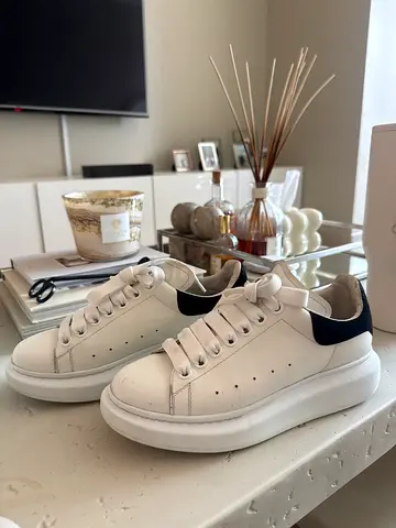 White Alexander McQueen leather sneakers with black heel detail - lightly used