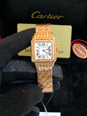 Cartier watch in 18k rose gold featuring a diamond-set bezel and a signature silvered dial Mysore qu