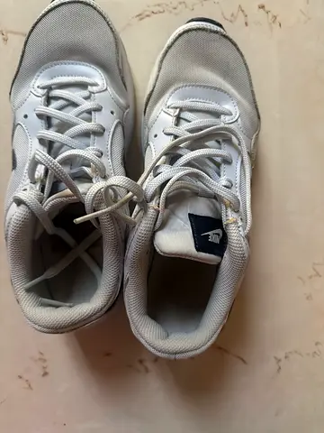 Used white Nike sneakers - good condition, size not labeled