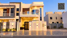 Villa for sale in Al Helio, Ajman—registration fees included. Features 5 master bedrooms, a majlis