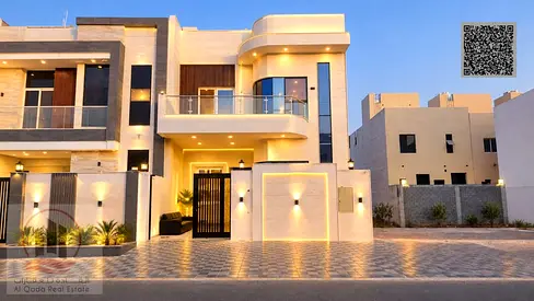 Villa for sale in Al Helio, Ajman—registration fees included. Features 5 master bedrooms, a majlis, a living area, and a maid's room. Freehold ownersh