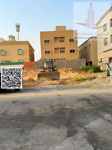 A **residential and commercial plot** is available for sale in **Al Mowaihat 1, Ajman**, featuring an excellent location and situated very close to *