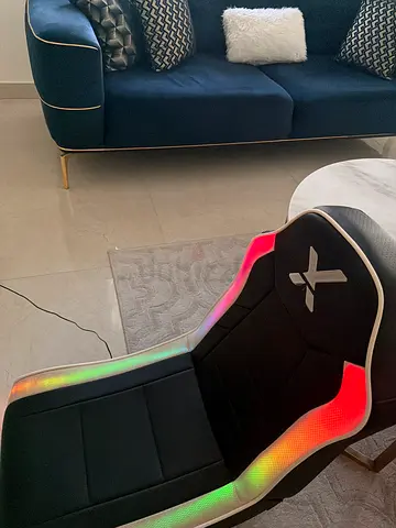 Lounge gaming chair with rgb and speakers with 3d imersion volume $%& and easy to transport