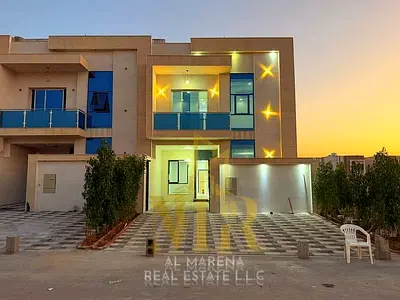Villa for sale in Al Helio, Ajman – Registration fees included. Features 6 master bedrooms, a majlis, a living area, and a maid's room. Freehold owner