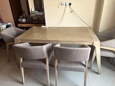 Light wood dining table with 4 upholstered chairs - excellent condition
