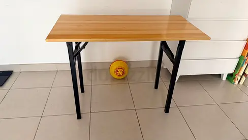 Folding wooden-top table with metal legs — good condition