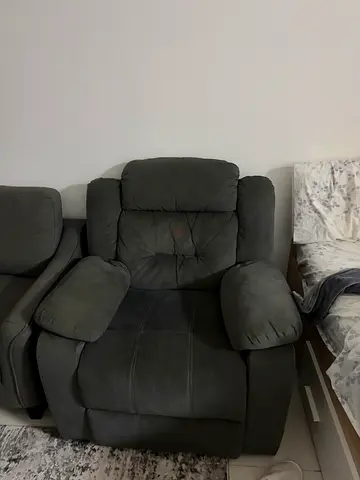 Grey single reclining armchair in good condition