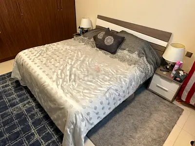 Queen bed frame with mattress and bedside tables & Matching dresser with vanity mirror. -GC