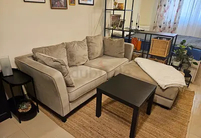 2-seater "The One" light beige sofa with footrest