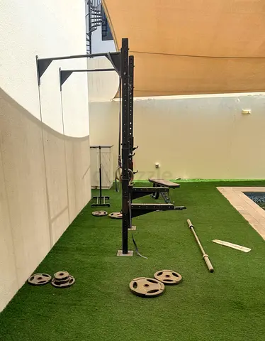 Half rack with bench, barbell and weight plates - used home gym set