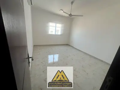 2BR in Al Rawda 2 with balcony, 2 baths, excellent split AC. AED 38,007/year, 4 payments.