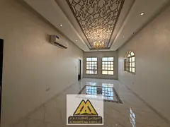 Annual villa for rent in Al Mowaihat, Ajman, featuring 5 master bedrooms, 2 living rooms, majlis, ma