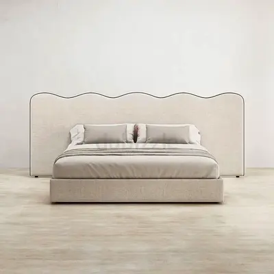 Modern scalloped fabric king bed with upholstered headboard