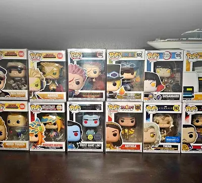 Collection of Assorted Funko Pop Figures In Boxes