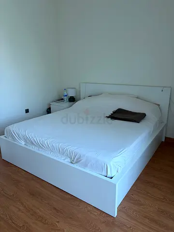 IKEA MALM King Size bed with under-bed storage and hydraulic lift.
