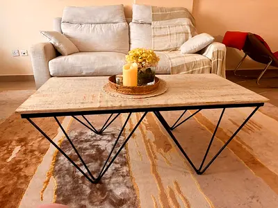 Modern wooden-top coffee table with geometric metal base