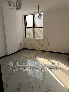 Muwaileh: One-bedroom apartment with a living room—first-time occupancy. Features central A/C and