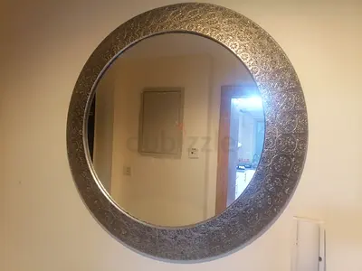 Round Decorative Wall Mirror with Ornate Silver Frame