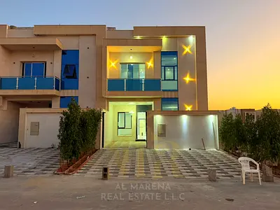 Villa for sale in Al Helio, Ajman – Registration fees included. Features 6 master bedrooms, a majlis, a living area, and a maid's room. Freehold owner