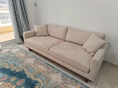 Beige 3-seater fabric sofa in good condition