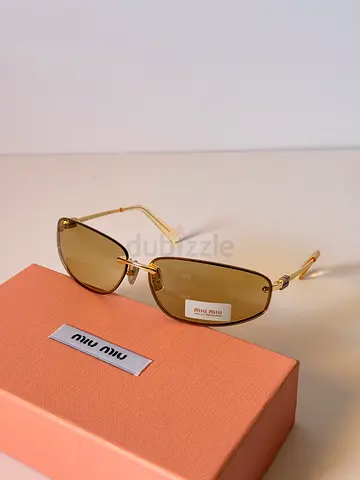 Miu Miu gold frame brown lens sunglasses with case