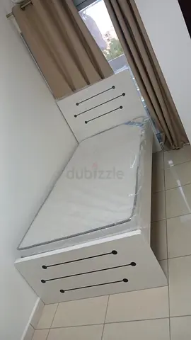 Single white bed with mattress — good condition