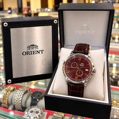 Orient men's automatic watch with brown dial and leather strap