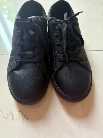 Black casual sneakers, gently used, size unknown