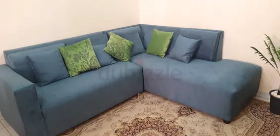 L-shaped teal fabric sofa with removable cushions - good condition