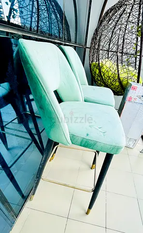 Pair of mint green velvet high chairs with gold-accent legs