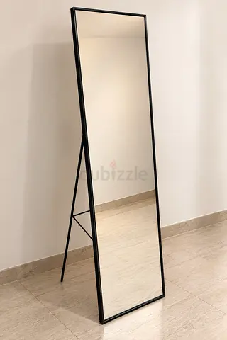 Full-length freestanding IKEA mirror with slim black frame